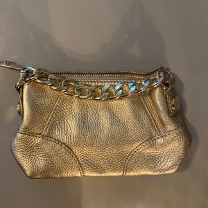 Michael Kors gold leather clutch.